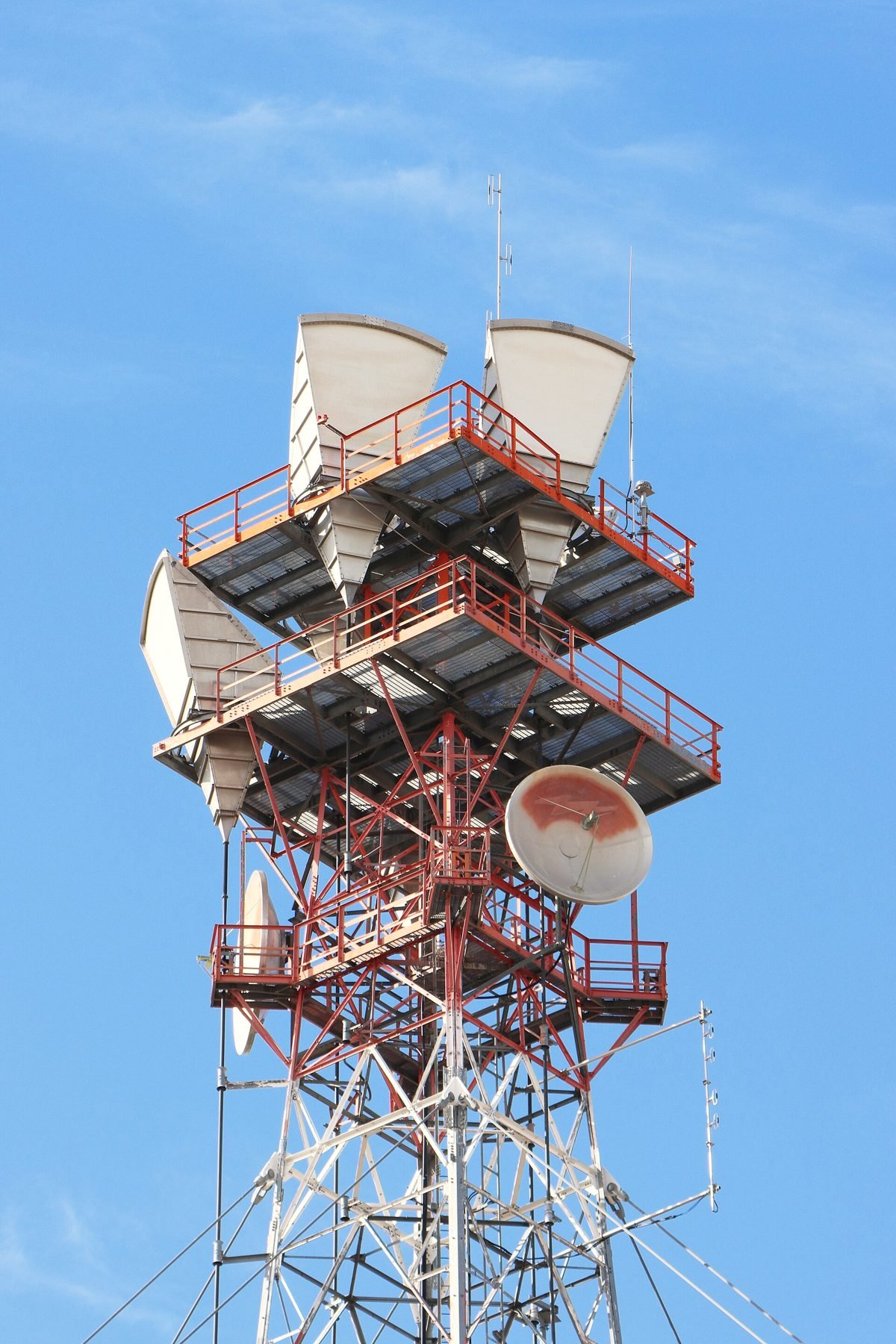 A lattice tower loaded with microwave dishes and antennas.