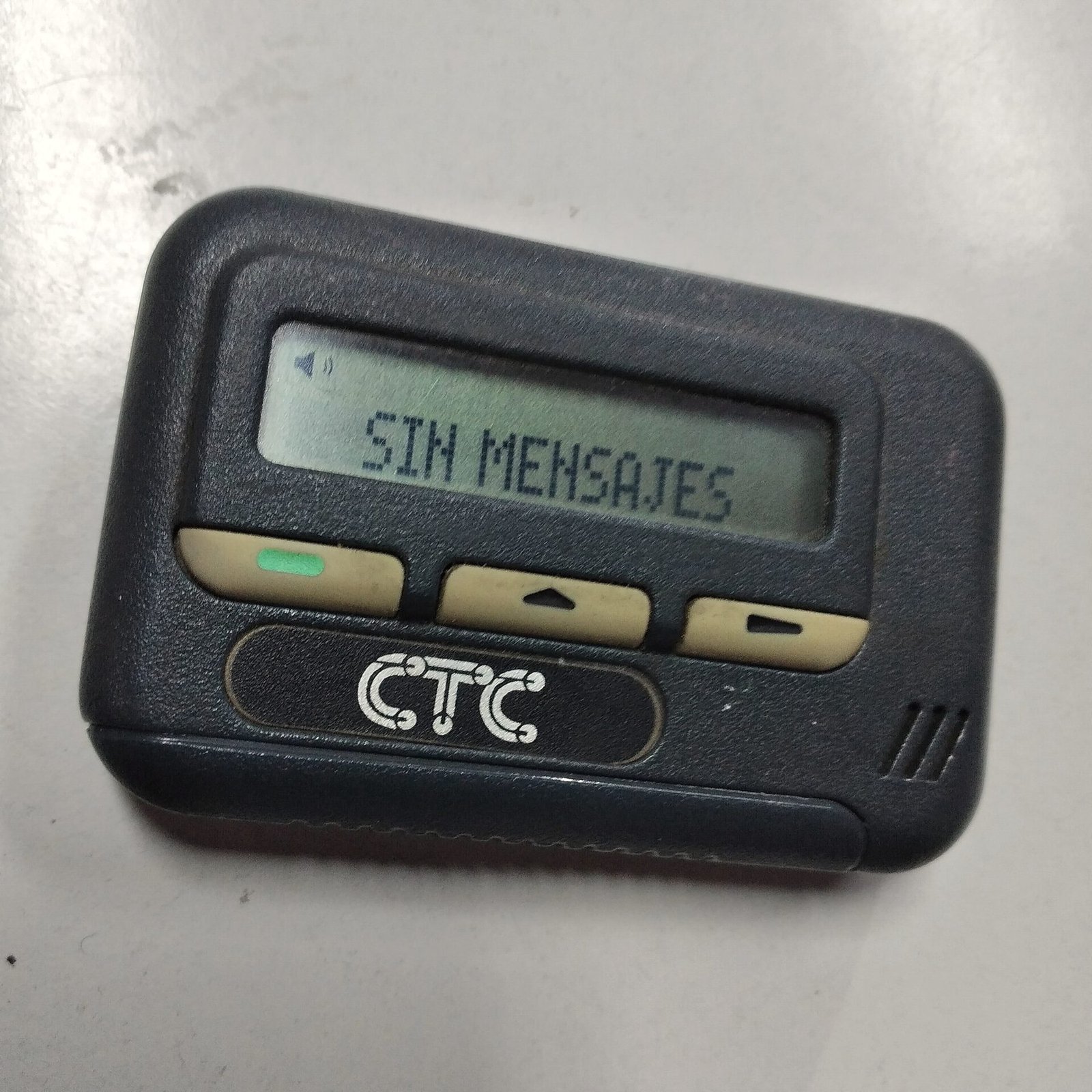 A classic black pager with a monochrome message display.